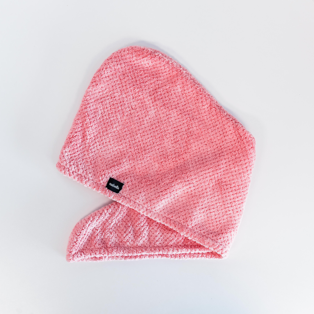 Hair towel pink laying down