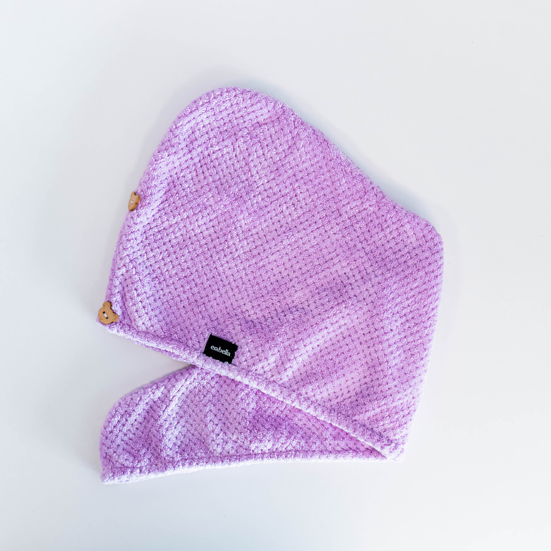 Hair towel light purple laying down